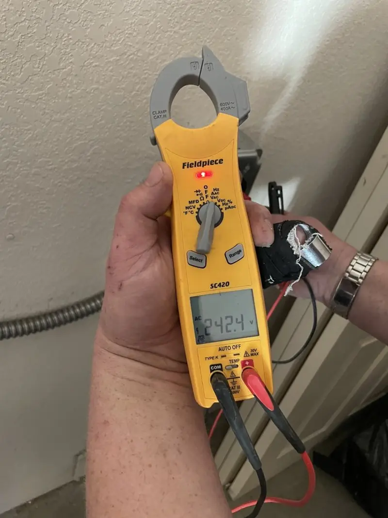 Voltage testing with clamp meter during Generator Installation in Hollywood Park
